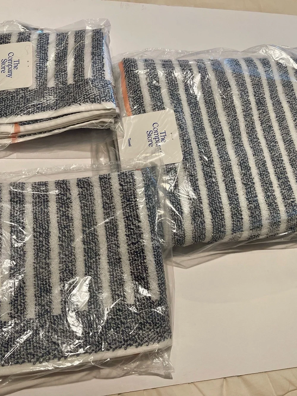 The Company Store 4 piece Navy & White Striped Towel set with Peach Accent